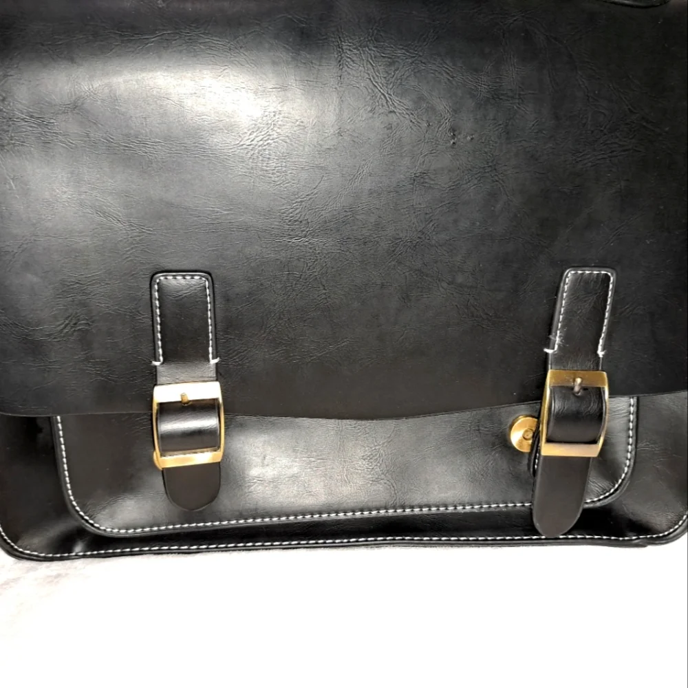 Leather like briefcase. Holds a 13 inch laptop.